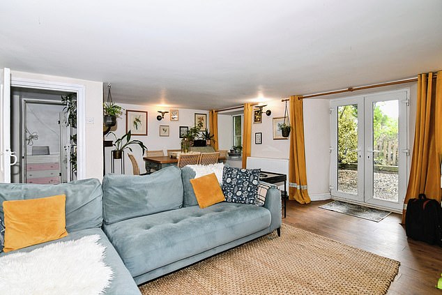 The upper level has two double bedrooms that offer serene countryside views and period features like window shutters and one offering built-in storage