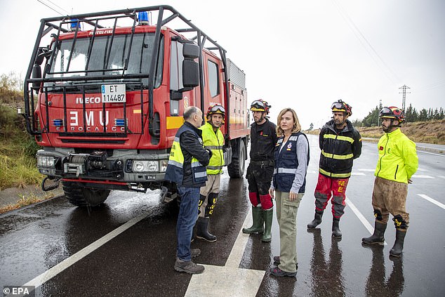 The Military Emergency Unit (UME) - the branch of the army responsible for national disaster or emergency relief - has been deployed across the province to help. Pictured: Spanish Education Minister PIlar Alegria meets the UME in Aragon on Saturday