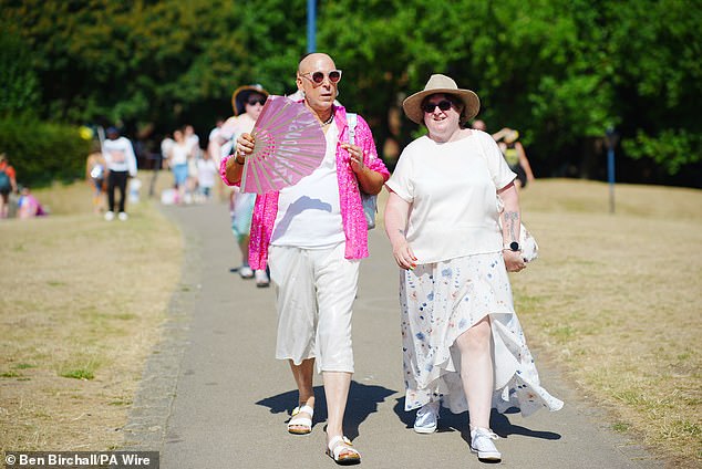National Rail has also warned train passengers that the hot weather may cause disruption this weekend. Pictured: Attendees at the Bristol Pride festival on Saturday