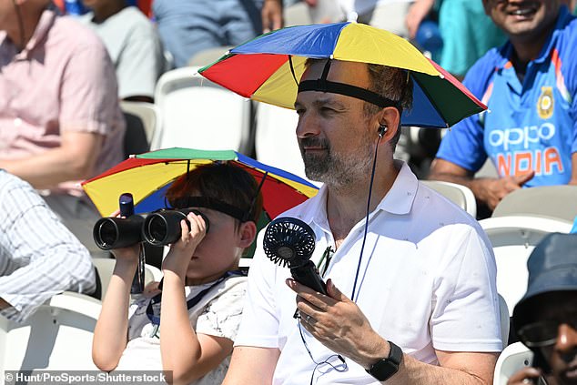 The Met Office said though temperatures may peak on Saturday, it will remain 'very warm' across the country on Sunday. Pictured: A father and son at Lord Cricket's Ground on Saturday