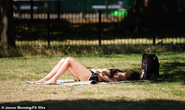 As well as the amber alerts, the UK Health Security Agency (UKHSA) has yellow alerts in place until Monday for the North East, North West and Yorkshire and Humber. Pictured: A sunbather in London's Vauxhall Park on Saturday