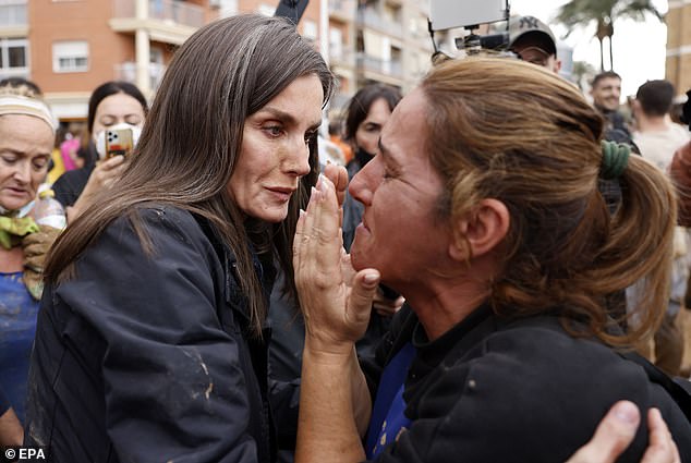 Shocking footage emerged showing how parts of Valencia became completely engulfed by deadly flash floods that appeared from nowhere. Pictured: Spain's Queen Letizia consoles a woman during her visit to Paiporta, eastern Spain, on November 3, 2024