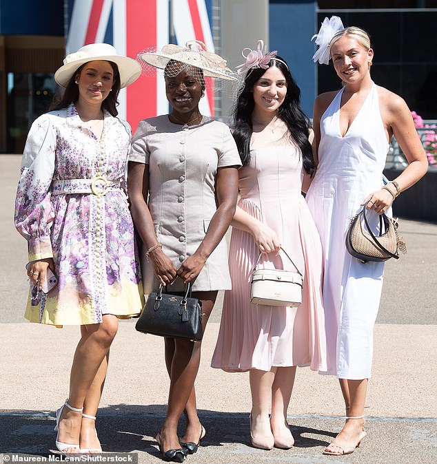 Pictured: Revellers pose for pictures at Racing to Zero Summer Mile Family Raceday at Ascot Racecourse in Berkshire