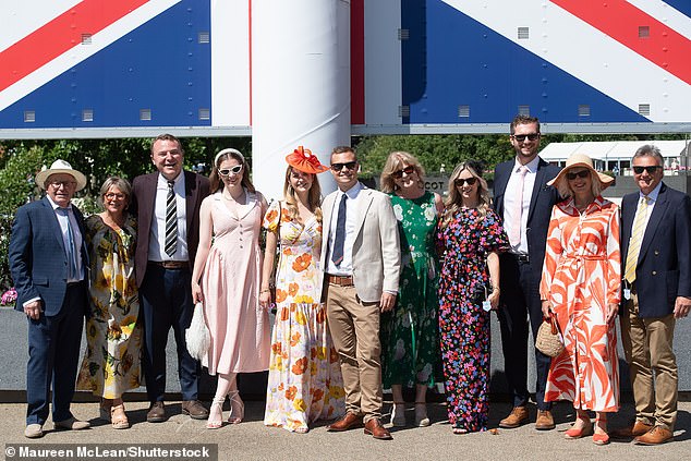 Pictured: Revellers pose for pictures at Racing to Zero Summer Mile Family Raceday at Ascot Racecourse in Berkshire