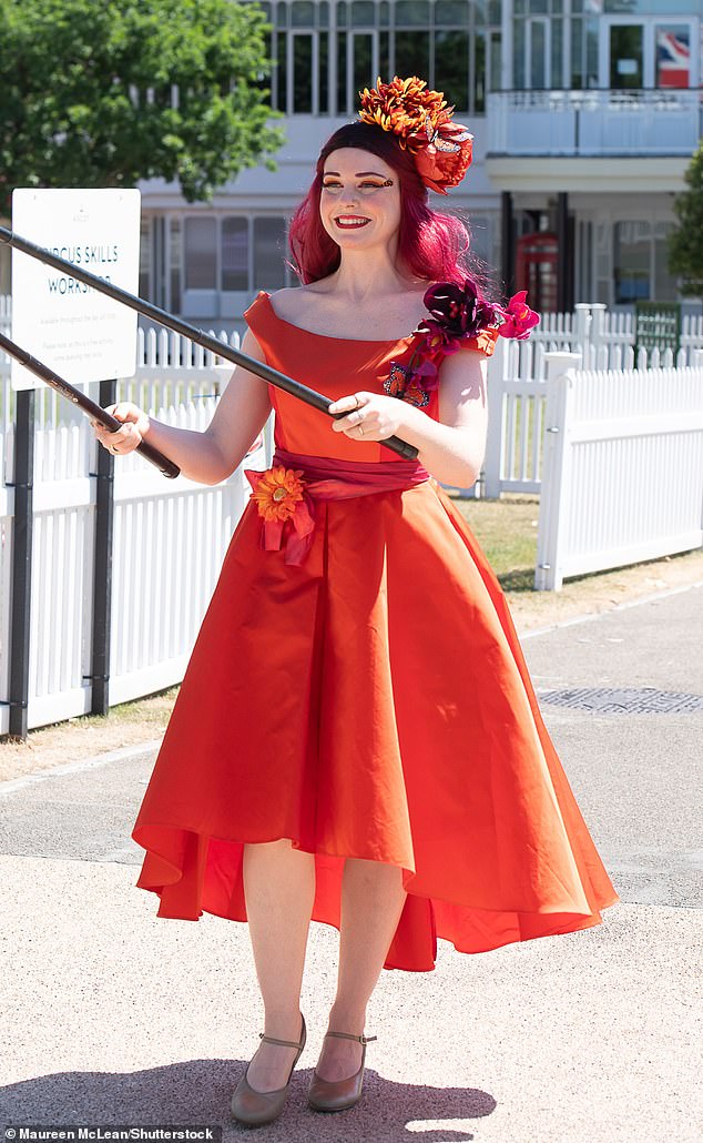 Bright and bold colours were a common theme at today's racing event in Berkshire, with one woman sporting a summery orange shade