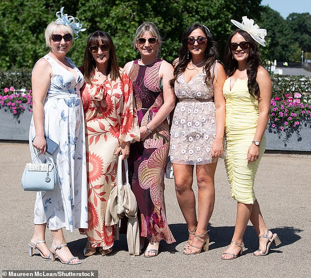 Pictured: Revellers pose for pictures at Racing to Zero Summer Mile Family Raceday at Ascot Racecourse in Berkshire