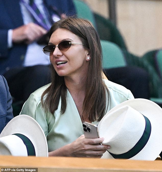 Romania's tennis player Simona Halep sat in the Royal Box on Centre Court for the women's singles final tennis match