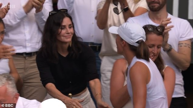 The Friends actress was among a star-studded lineup at Centre Court, and was quick to congratulate Iga after she rushed to the stands following her victory