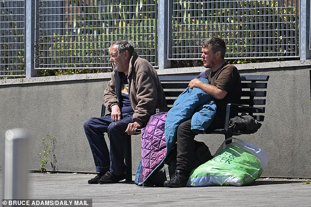 Two men sat on a bench in Market Place. The area was hardly busy when MailOnline visited on a weekday afternoon