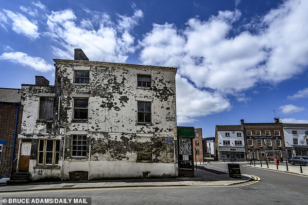 Pictured: The Baines Shop on Queen Street. Another building sat in complete disrepair