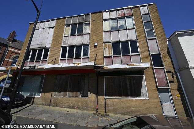 Another empty office building on William Clowes Street. The windows have been boarded up