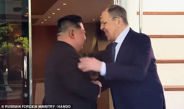 Kim Jong un and Lavrov shake hands at their meeting in the glitzy beach resort
