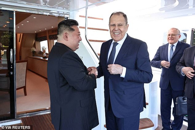 Kim Jong Un shakes hands with Russian Foreign Minister Sergei Lavrov during a meeting in Wonsan