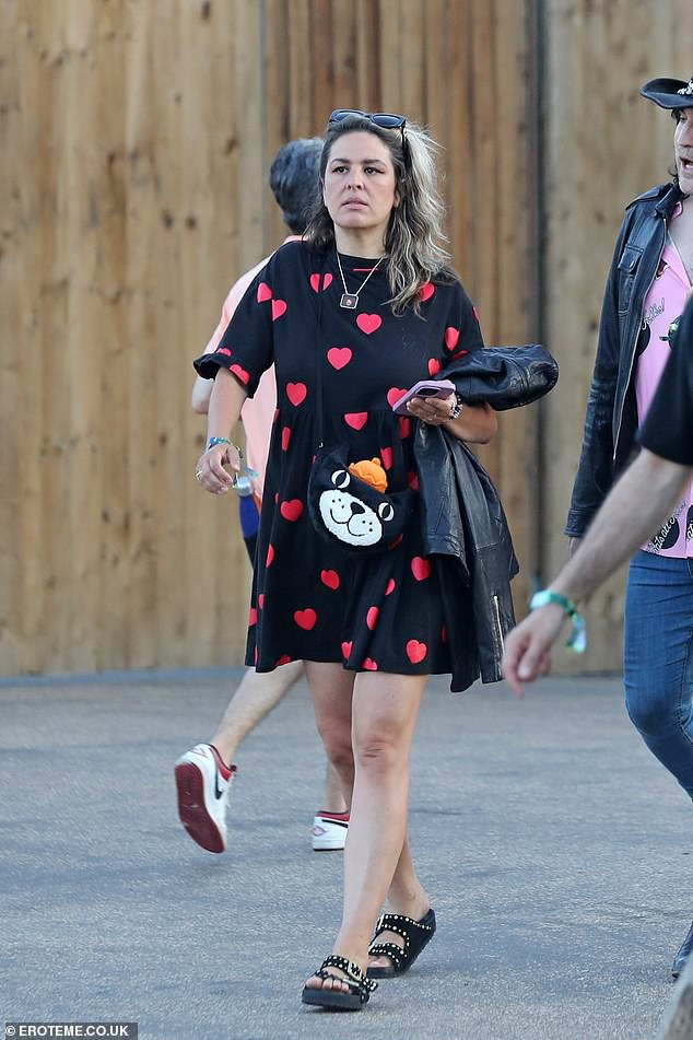 Lliana, 43, looked gorgeous in a floaty heart-printed smock dress and a pair of dark shades