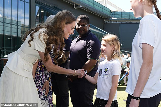 The Princess of Wales meets Lydia Lowe, eight, from the Dan Maskell Tennis Trust