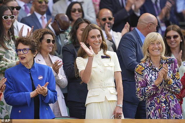 Kate waves to the crowd as she entered Centre Court ahead of the women's final today