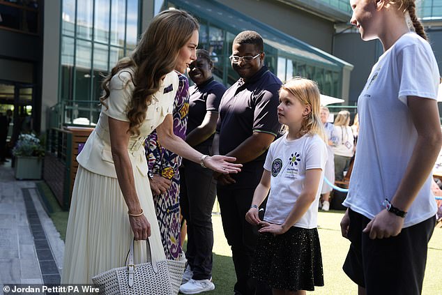 The Princess of Wales meets Lydia Lowe, eight, from the Dan Maskell Tennis Trust