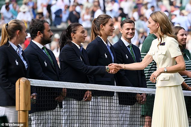 Catherine, the Princess of Wales, shakes hands with Wimbledon staff