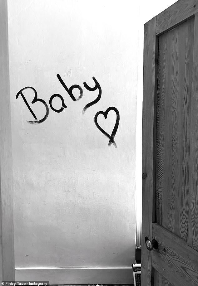 Another photo captured a room mid-renovation with the word 'baby' painted on the wall - hinting at preparations already underway for their little one's arrival