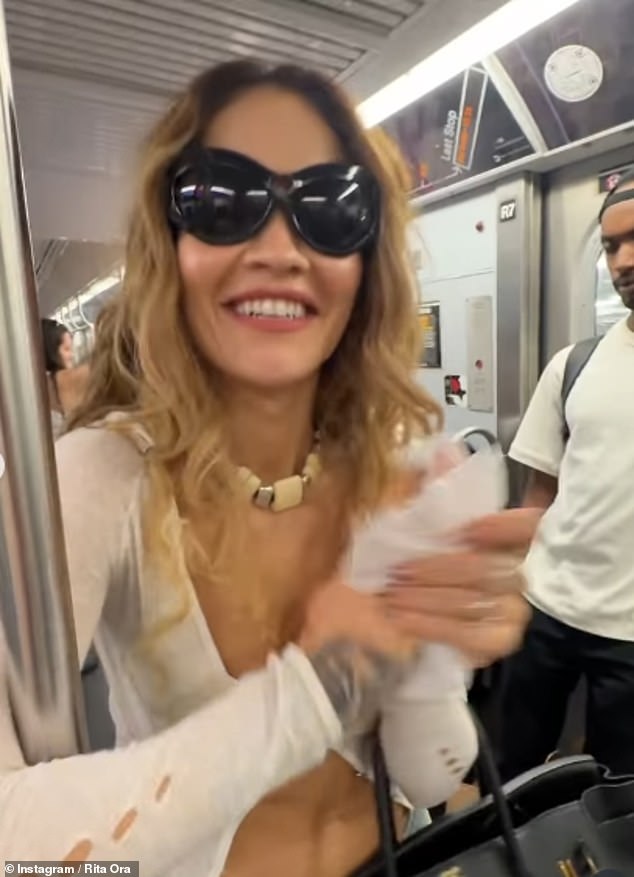 In fun snaps she shared on Instagram, Rita playfully rummaged through her designer bag for some hand wipes, admitting in the comments she was reluctant to hold onto the subway's pole