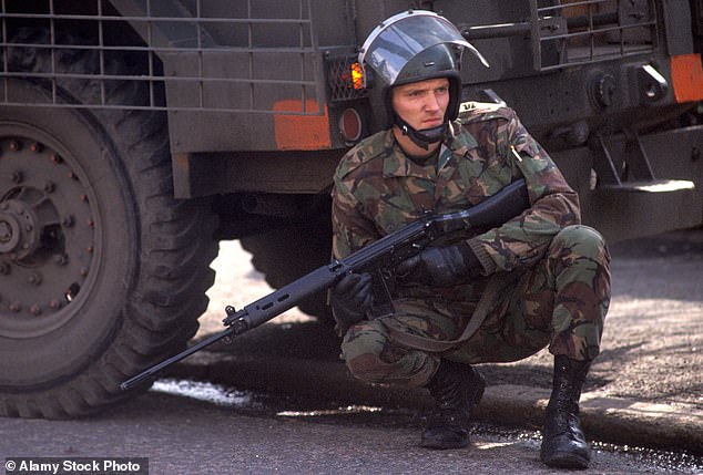 A British army soldier on patrol during The Troubles in Northern Ireland -- March 1983