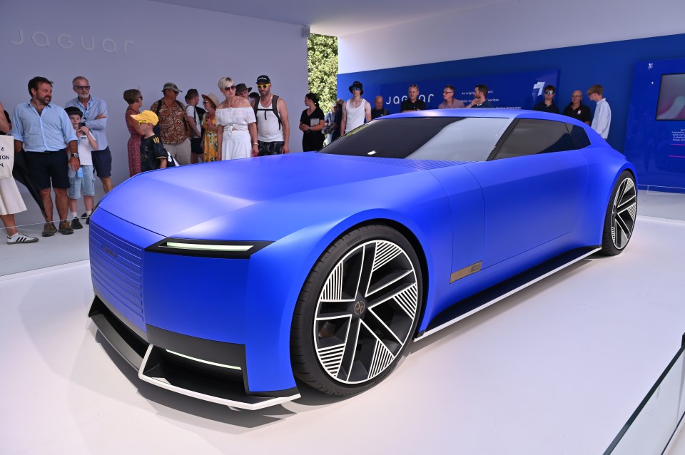 Blue Jaguar Type 00 concept car on display.