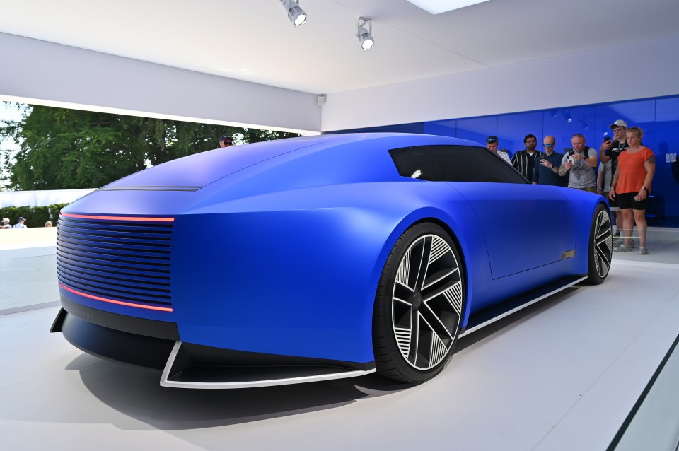 Rear view of a blue Jaguar Type 00 concept car.