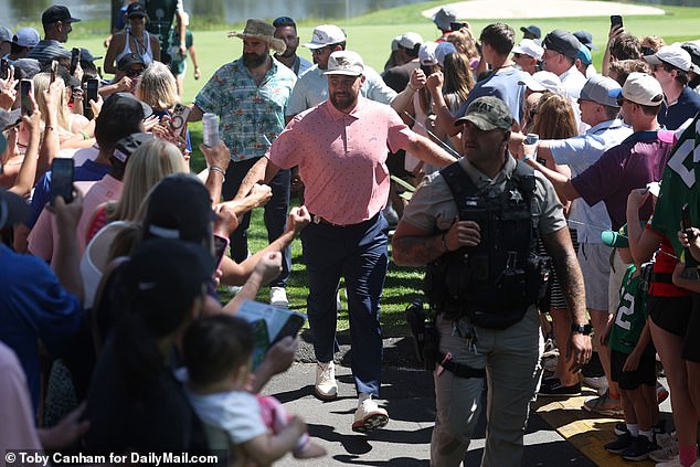 The brothers, playing alongside Baker Mayfield, were accompanied by a SWAT team