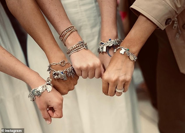 'I met beautiful young ladies. They gave me this special bracelet from the camp in honor of all of the little girls that lost their lives,' the First Lady said during a visit to the flood-ravaged area