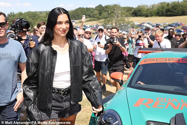 The singer arrvied at the event in a black leather jacket and black, ripped jean shorts and a white T-shirt