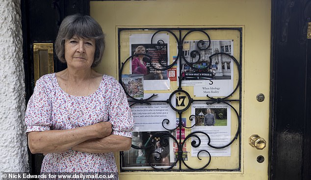 The pinboard, which hangs on the front of her yellow door, is filled with news clippings highlighting wins for activists like Una, such as the Supreme Court ruling that legally the term 'woman' means a biological woman