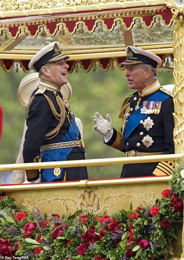 Prince Philip laughs while talking to his son - Prince Charles - during the late Queen's Diamond Jubilee celebrations. Philip was then admitted to hospital the following day meaning he missed the concert at Buckingham Palace