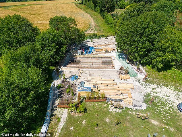 Now, neighbours who overlooked the development have spoken of their 'joy and 'relief' after the couple began taking down the structure