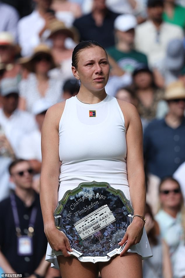 Runner up Anisimova with her trophy after losing the women's singles final