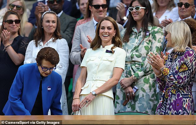 Catherine is all smiles as Wimbledon erupts into clapping as she takes her seat next to AELTC chair Debbie Jevans