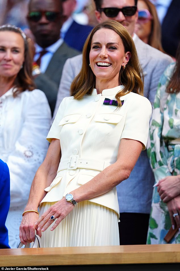 Kate beams as she sports a cheek cream ensemble alongside a dark purple and black 'Wimbledon bow'