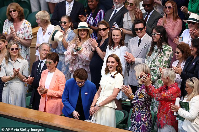 She continues to beam next to former tennis player Billie Jean King ahead of the match as viewers prepare to watch the 13th day of the world-renowned tournament
