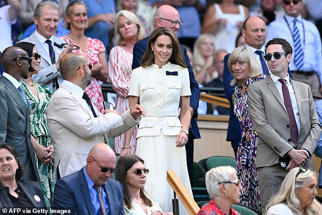 Princess Catherine walks down to her seat in the Royal Box today ahead of the match