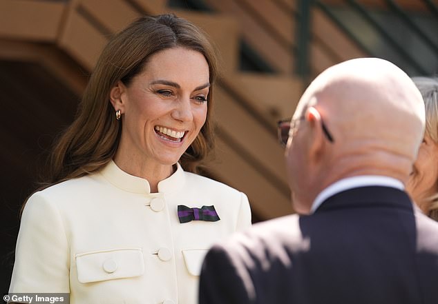 Pictured: Kate smiling as she met Bob Flint, Wimbledon's longest serving Honorary Steward, today
