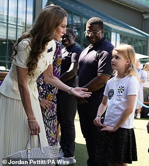 Kate met Lydia Lowe, eight, from the Dan Maskell Tennis Trust, before watching the final on Saturday