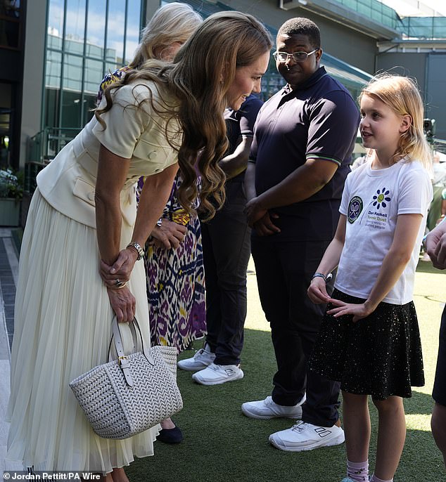 The royal paired her ensemble with a £950 woven leather tote bag from popular designer Anya Hindmarsh