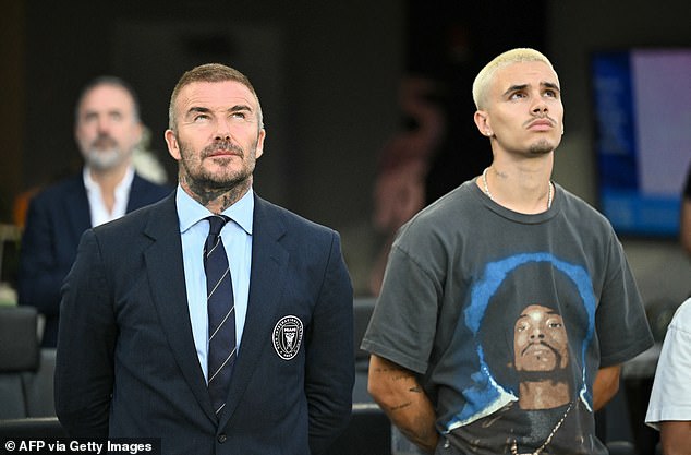Meanwhile Romeo, 22, opted for a more casual look in a grey graphic T-shirt and green camouflage cargos, while accessorising with a flashy £31k Rolex watch