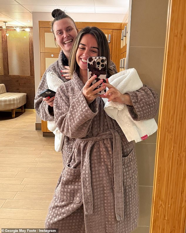 Her wedding ring was noticeably absent in a recent Instagram post, where she enjoyed a spa break with her best friend (pictured)