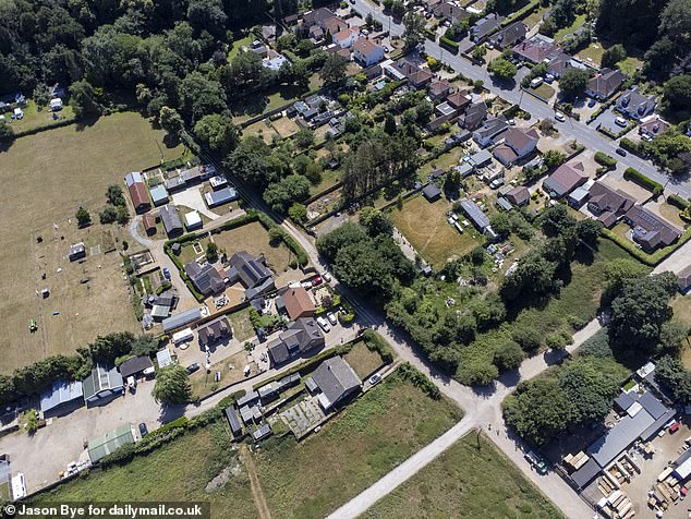 But a different neighbour, aged 93, who lives with his wife nearby, said: 'If it was someone doing it next to me I would make a complaint. The council knows what the rules are'