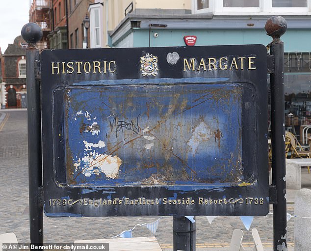 Yards away a sign advertising the town as 'England's earliest seaside resort' is filthy