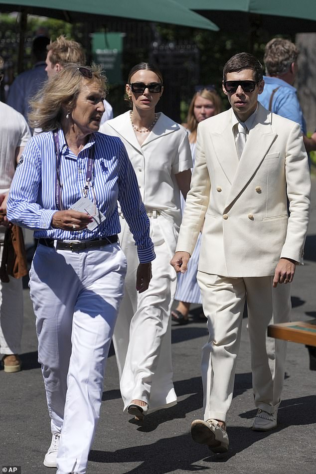 The actress, 40, opted for a befittingly all-white ensemble, looking chic in a button-up shirt and tailored trousers, with a string of elegant pearls and a bejewelled belt