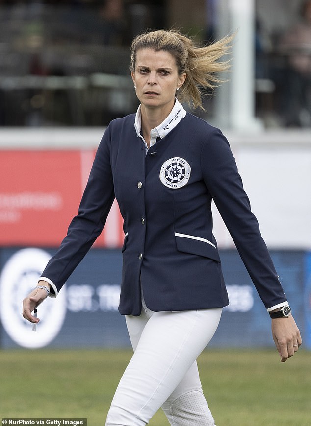 Athina is often photographed sporting a solemn expression, her signature bleached hair and her riding gear (pictured in 2019)