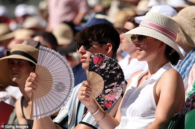 LONDON: Spectators fan themselves as they sit in the sun during the Ladies' Singles Final match on July 12, 2025