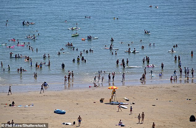 SWANSEA: People took to the in the sea during the UK heatwave at Langland Bay on July 12, 2025