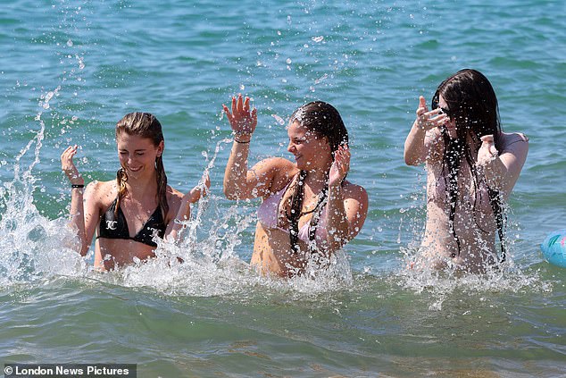 SUSSEX: Friends from Crawley cool off in the sea at Brighton Beach on July 12, 2025